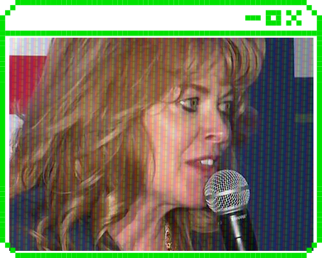 Stacy Garrity speaking at a microphone